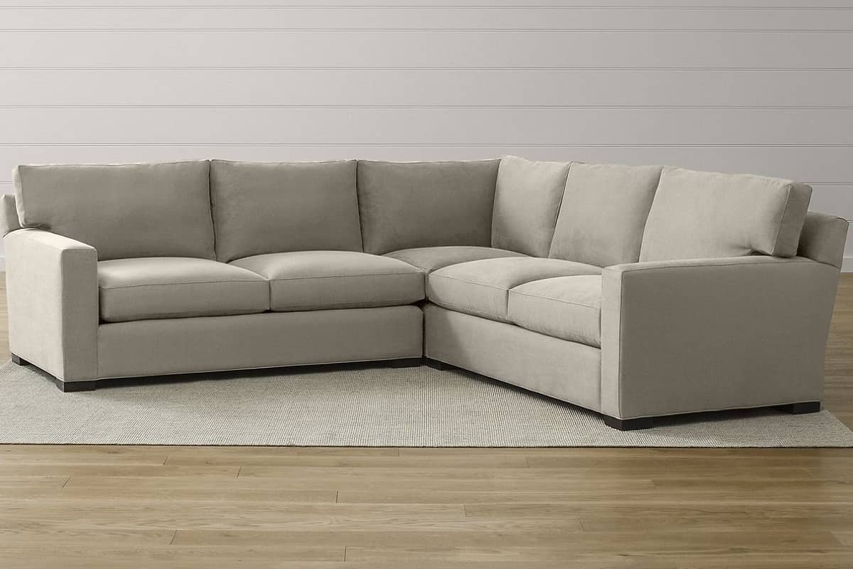 Большой угловой диван еврокнижка Непал в интерьере гостиной комнаты