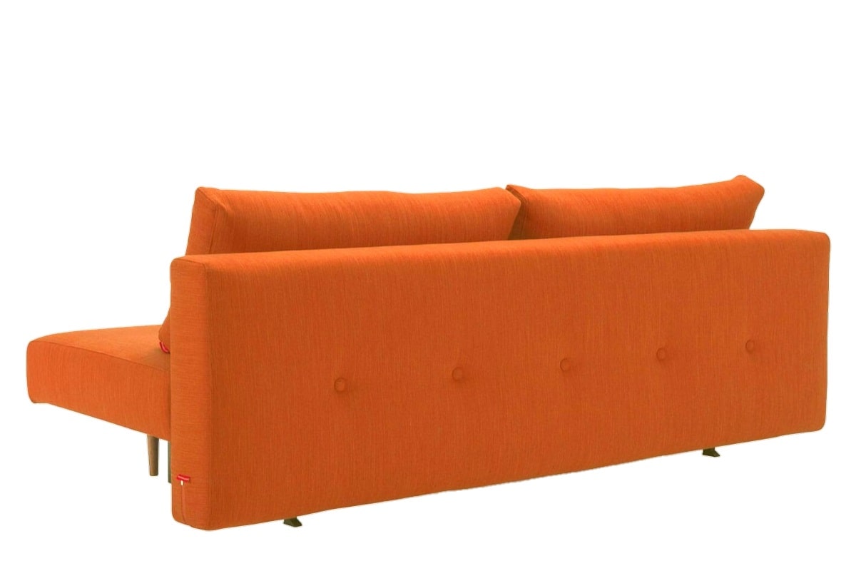 Вид сзади оранжевого дивана еврокнижка Варшава