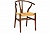 Фото дизайнерского деревянного стула Вишбоне с плетеным сидением из ротанга