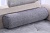 Фото удлиненной серой цилиндрической подушки-валика для кровати